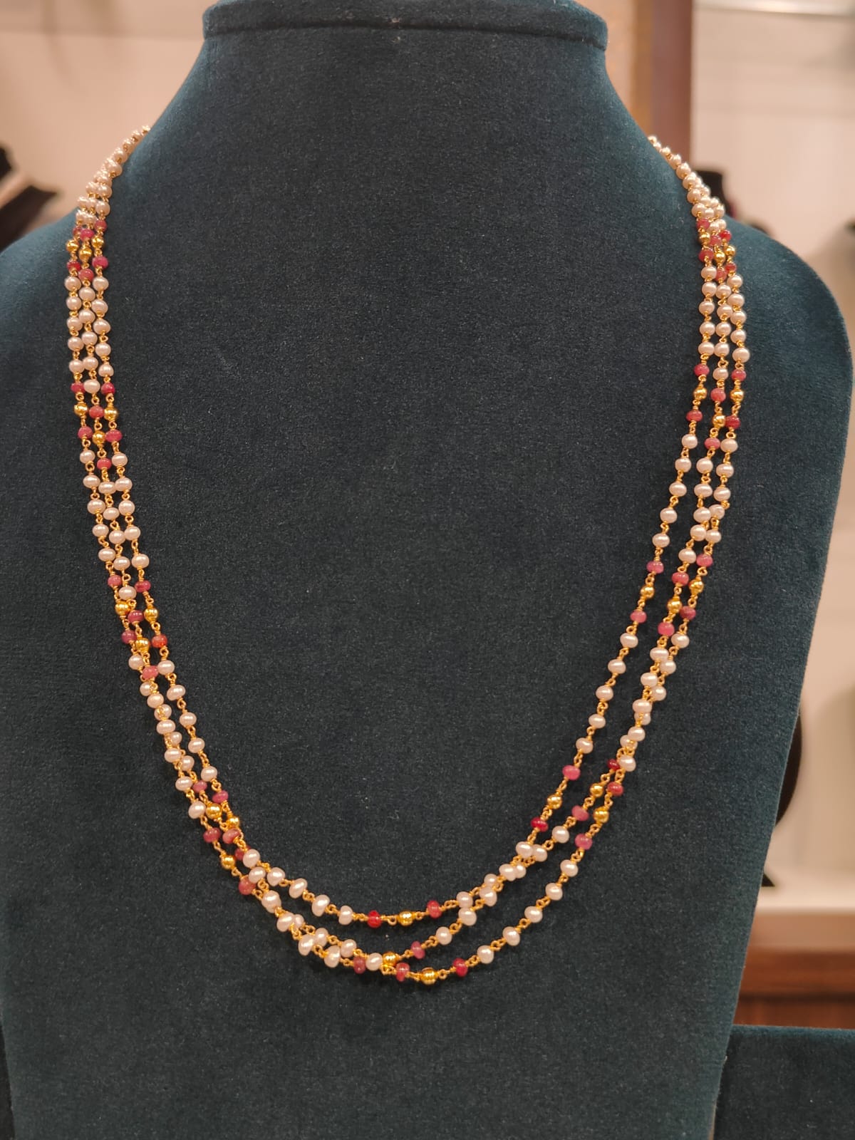 3 Lines Tharmala With Round Cultured Pearls , Ruby Beads and Gold Plated Ball